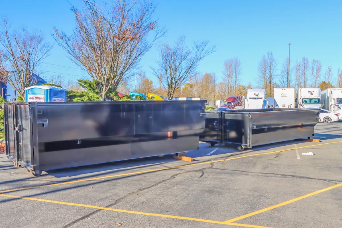Professional dumpster rental service with roll-off container on residential driveway in Cherokee Village